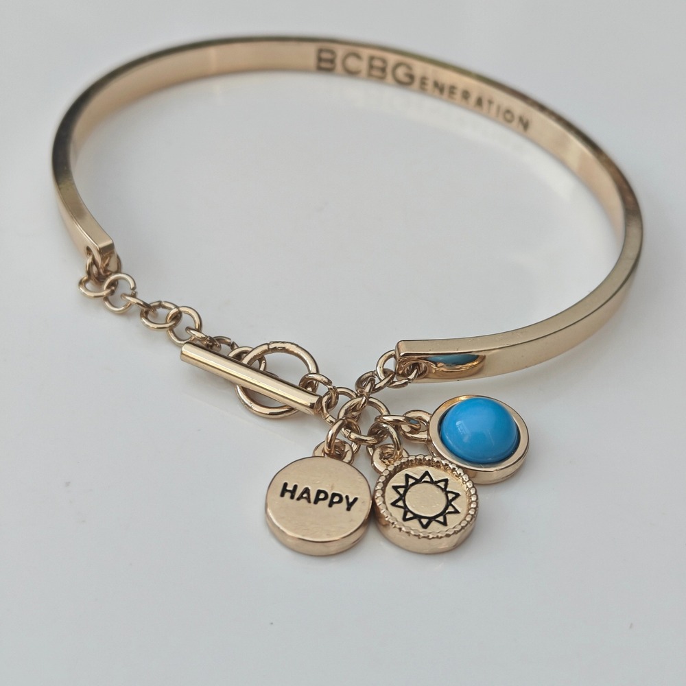 BCBGeneration Gold Tone Happy Sun Blue Stone Toggle Bangle Charm Bracelet Cuff